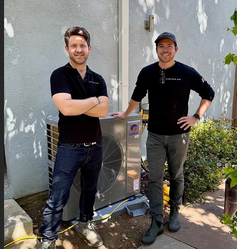 Electric Air technicians with heat pump