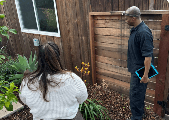 Electric Air technician with homeowner