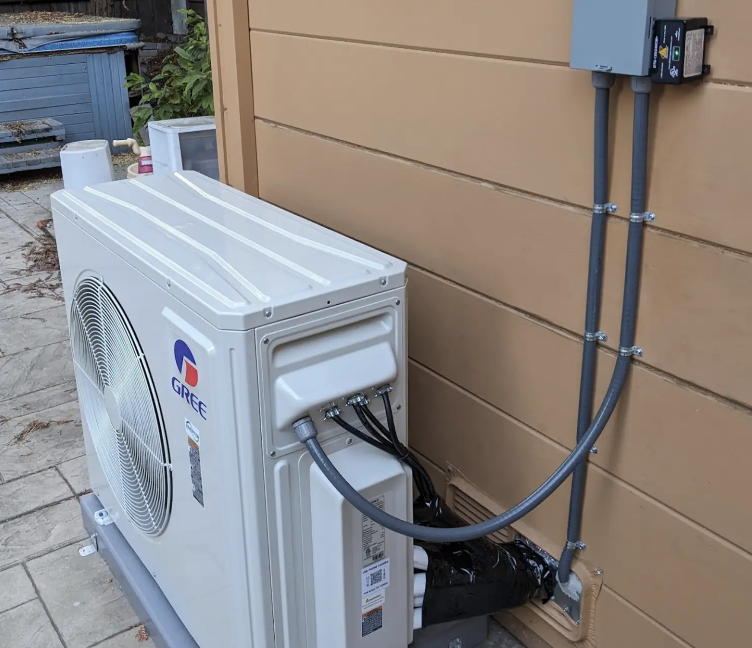 Heat pump installation on house exterior